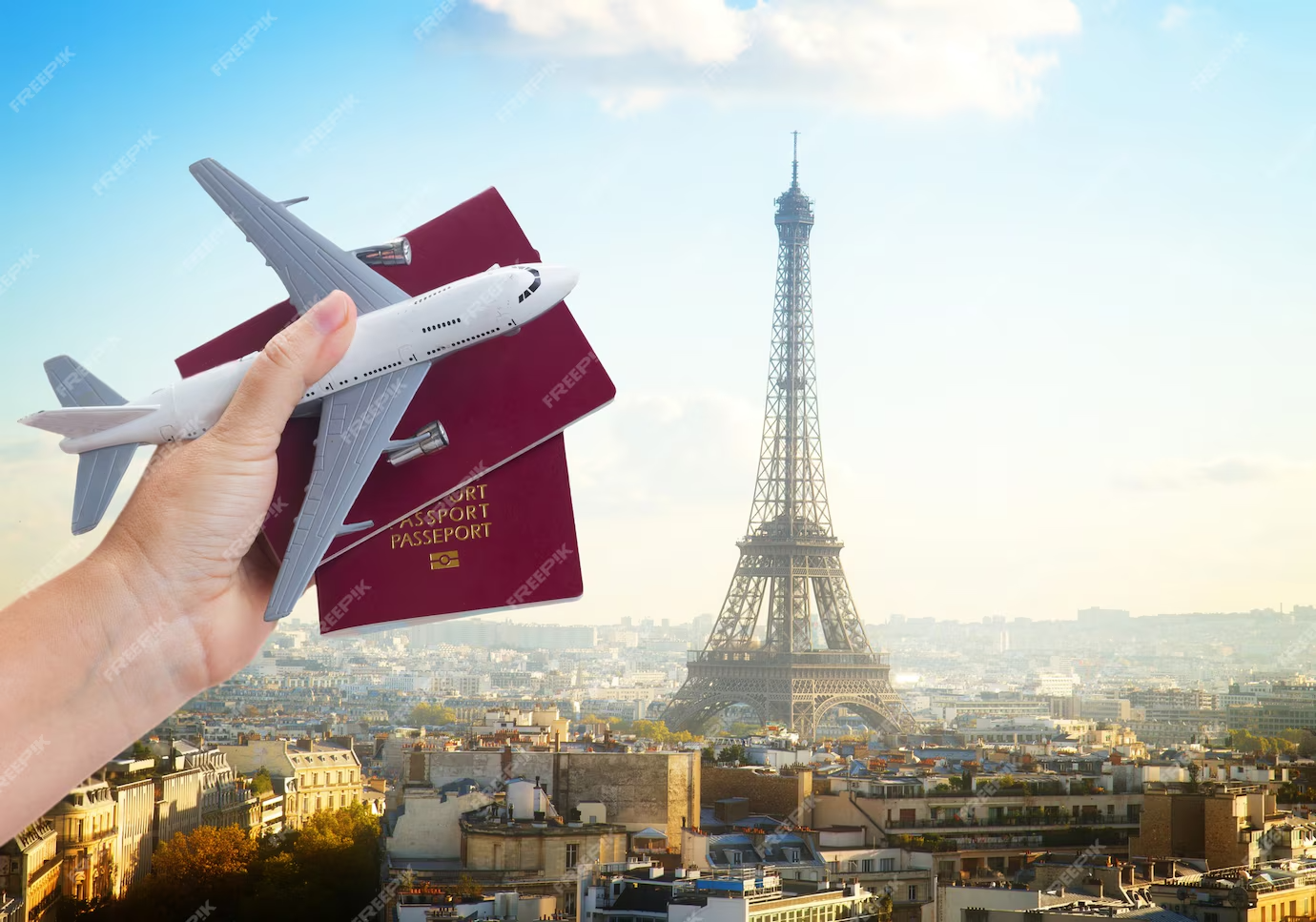 plane travel concept hand holding passports with plane paris france cityscape background_257123 5483